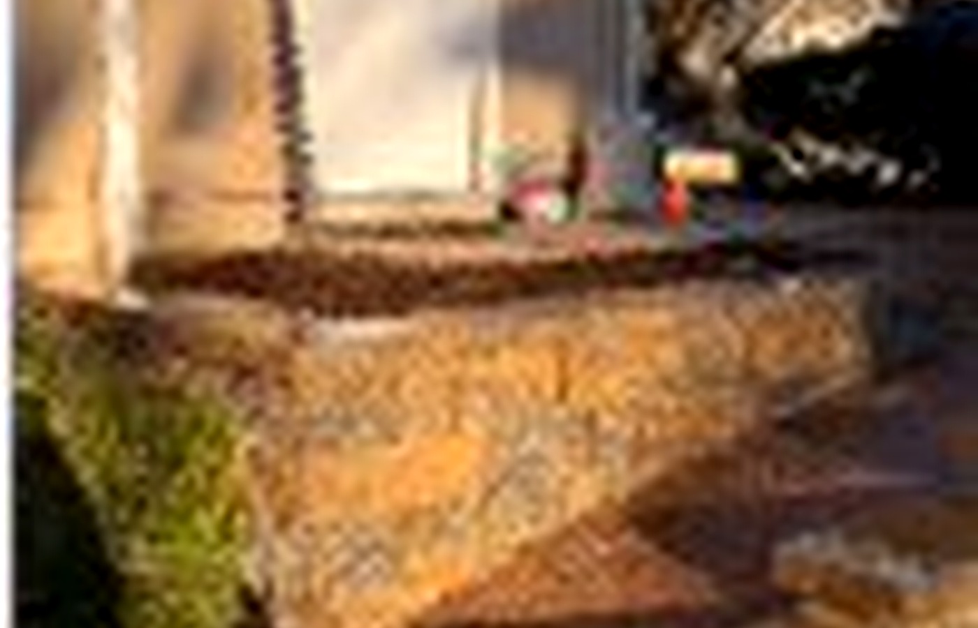 Stone steps and wall with gravel